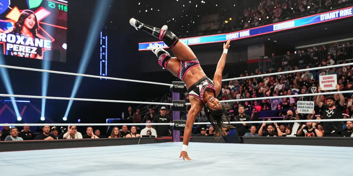Roxanne Perez performing an impressive move in a wrestling match, showcasing her athleticism and skills.