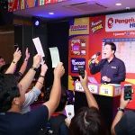 Exciting live lottery draw with audience celebrating Pengeluaran HK results and winning tickets