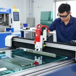 Technician using glass cutting machine cnc in a modern glass processing facility